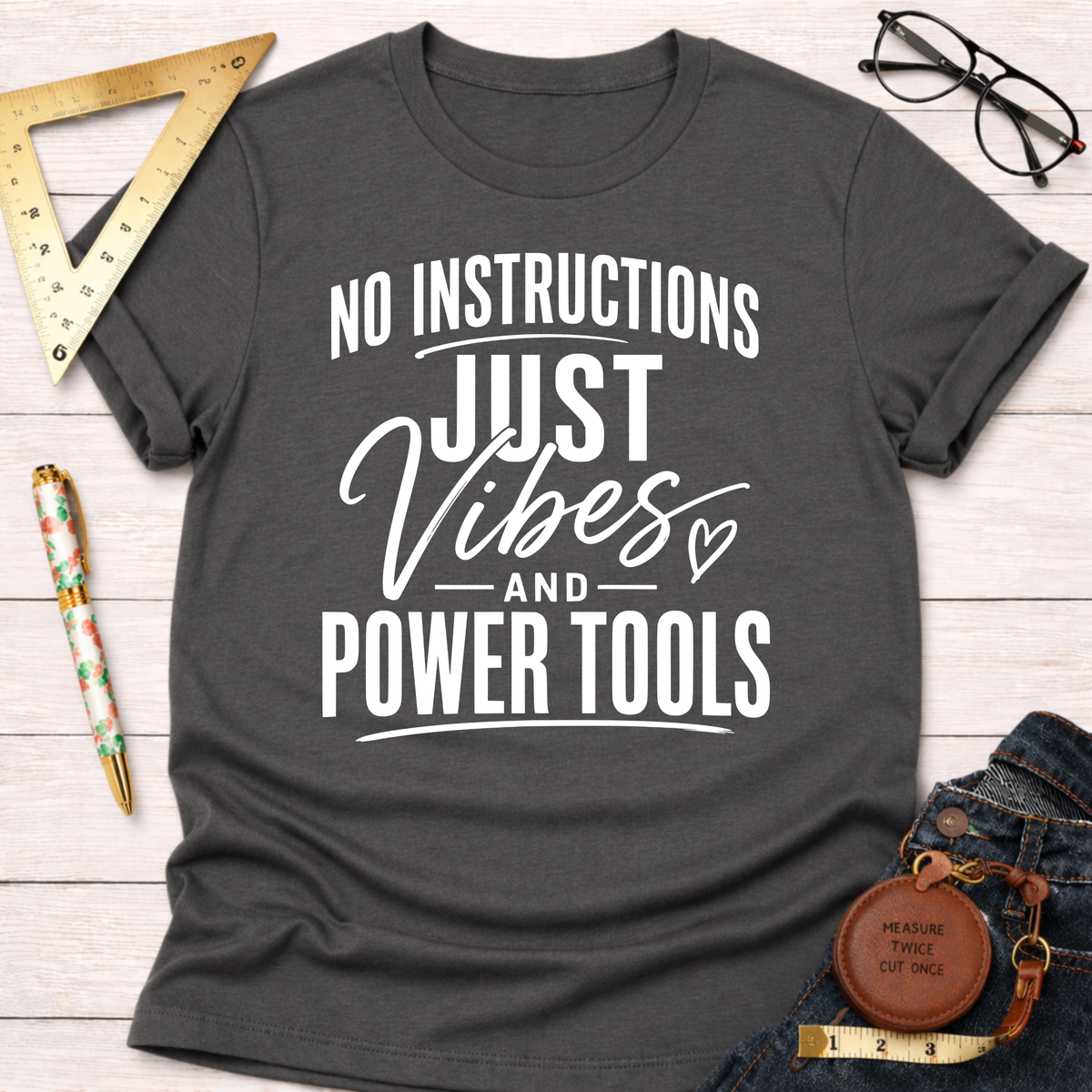 Charcoal gray t-shirt with "No Instructions Just Vibes And Power Tools" in white text.