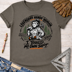 Charcoal gray cotton tee with "Legendary Handy Woman I Build My Own Sh*t" Bigfoot graphic. Women's funny woodworking graphic tee shirt for female woodworkers, makers, and DIY builders — Sawdust & Ponytails