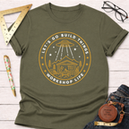 Olive green "Let's Go Build Things Workshop Life" T-shirt with a woodworking shop and UFO graphic.