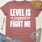 Women's funny woodworking graphic tee shirt for female woodworkers, makers, and DIY builders — Sawdust & Ponytails. Mauve cotton t-shirt with "LEVEL IS a suggestion FIGHT ME" in white text.