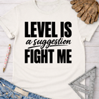 Women's funny woodworking graphic tee shirt for female woodworkers, makers, and DIY builders — Sawdust & Ponytails. Cream t-shirt with "LEVEL IS a suggestion FIGHT ME" in black text.