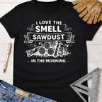 Women's funny woodworking graphic tee shirt for female woodworkers, makers, and DIY builders — Sawdust & Ponytails. Black cotton short-sleeve tee with white "I Love The Smell of Sawdust In The Morning" graphic.