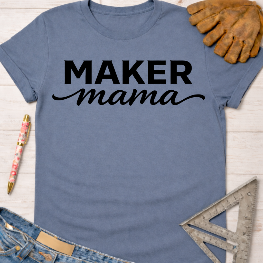 Blue cotton "Maker Mama" graphic tee with work gloves, jeans, and a ruler. Women's funny woodworking graphic tee shirt for female woodworkers, makers, and DIY builders — Sawdust & Ponytails.