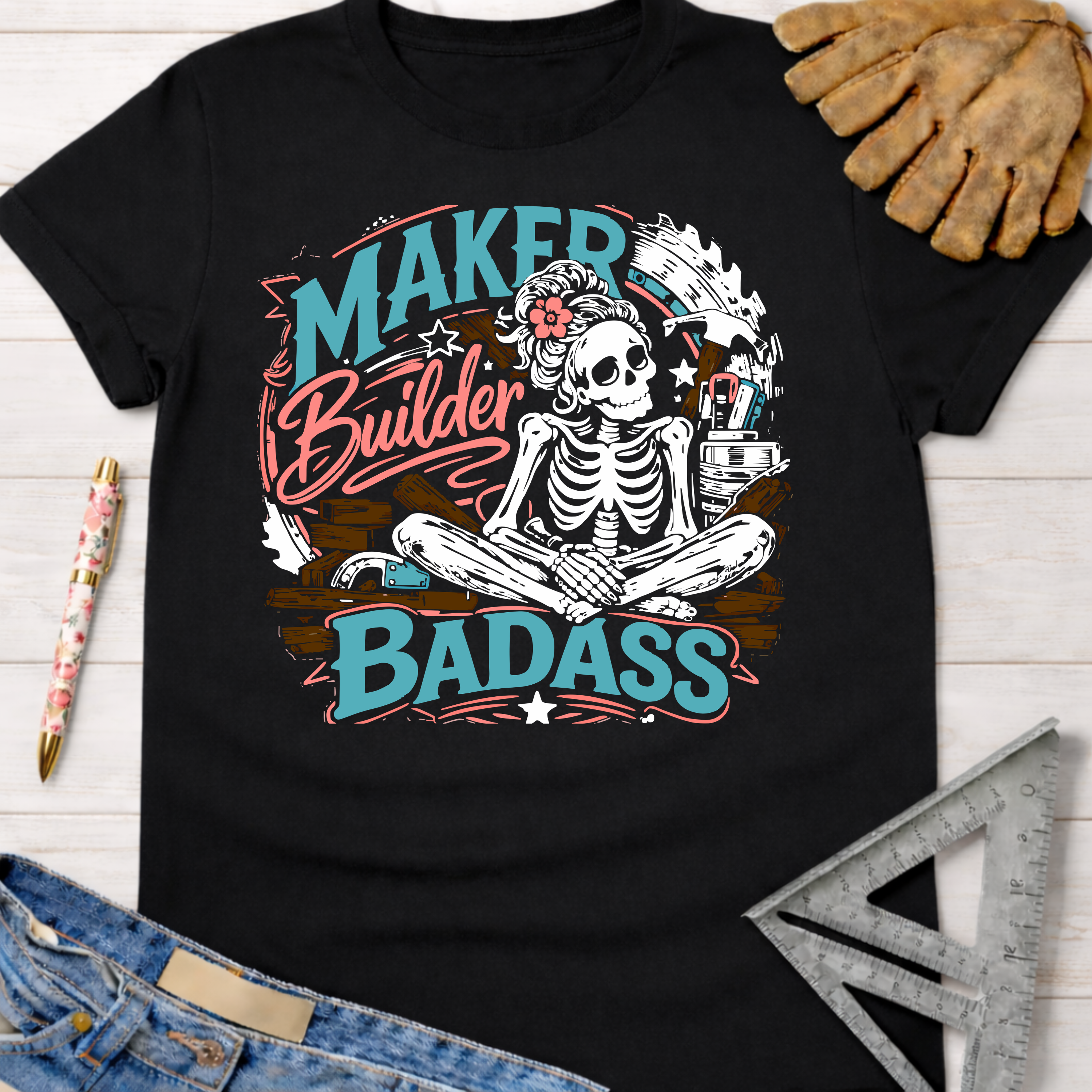 Women's funny woodworking graphic tee shirt for female woodworkers, makers, and DIY builders — Sawdust & Ponytails. Black cotton tee with a skeleton meditating, surrounded by tools, and "Maker Builder Badass" text.