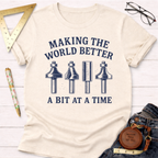 Women's funny woodworking graphic tee shirt for female woodworkers, makers, and DIY builders — Sawdust & Ponytails. Cream cotton t-shirt with "Making The World Better A Bit At A Time" text and router bit graphics.