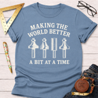 Women's funny woodworking graphic tee shirt for female woodworkers, makers, and DIY builders — Sawdust & Ponytails. Light blue cotton tee with "Making The World Better A Bit At A Time" text and router bit graphics.