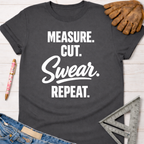 Charcoal gray women's "Measure. Cut. Swear. Repeat." graphic tee for female woodworkers, makers, and DIY builders — Sawdust & Ponytails