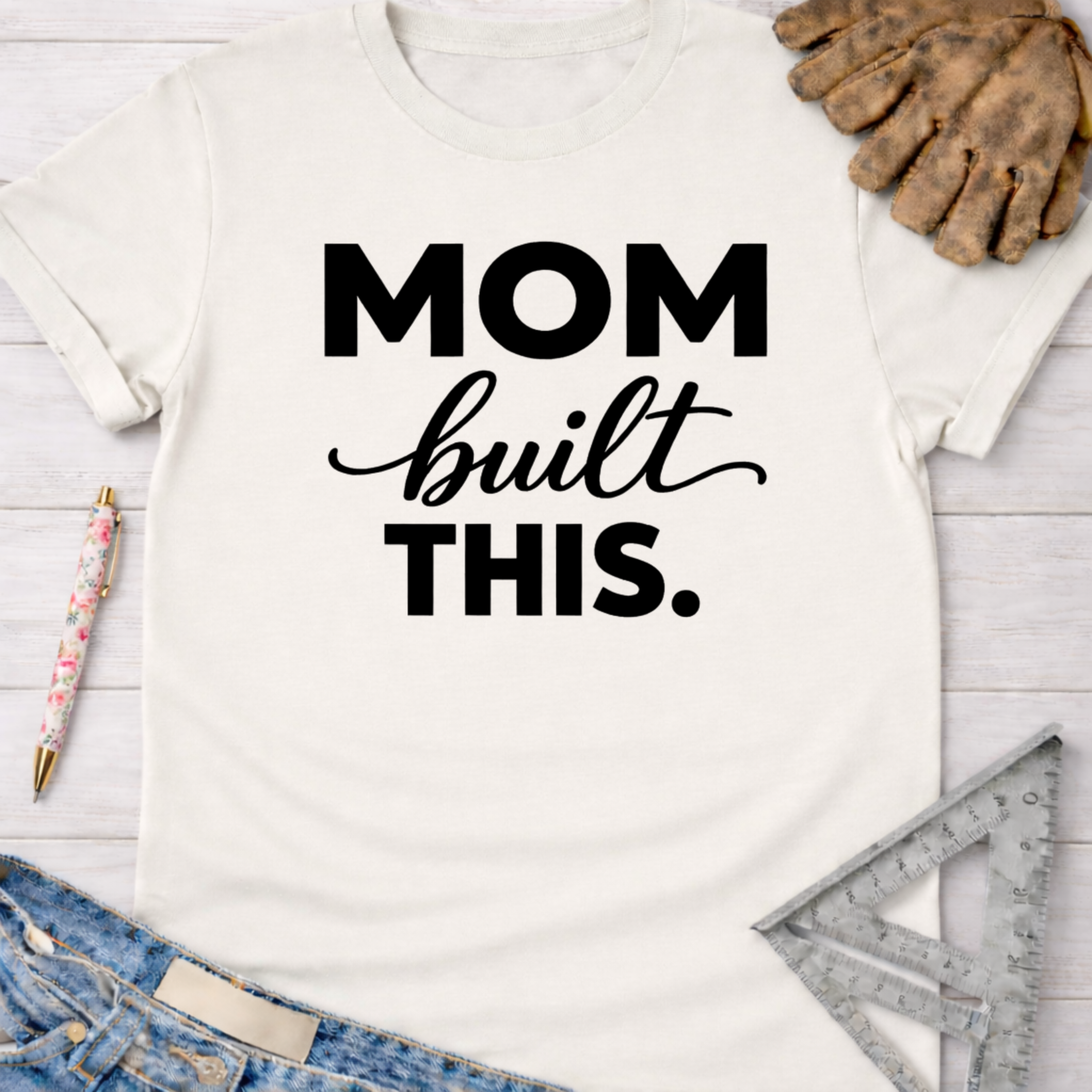 White cotton "Mom Built This" graphic tee, women's funny woodworking shirt for female makers.
