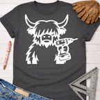 Women's funny woodworking graphic tee shirt for female woodworkers, makers, and DIY builders — Sawdust & Ponytails. Dark gray t-shirt with a white graphic of a shaggy cow holding a power drill.