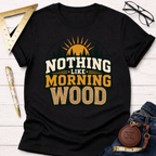 Black "Nothing Like Morning Wood" T-shirt with a sunrise, trees, and wood grain text design.