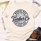 Morning Wood Timber Co. cream t-shirt with a dark blue tree ring logo.