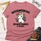 Pink heather t-shirt with a cute unicorn holding a hammer and "Woodworking Because Murder Is Wrong" text.