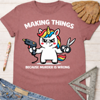 Women's funny woodworking graphic tee shirt for female woodworkers, makers, and DIY builders — Sawdust & Ponytails. Mauve t-shirt with a unicorn holding a glue gun and scissors, text reads "Making Things Because Murder Is Wrong.