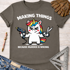Women's funny woodworking graphic tee shirt for female woodworkers, makers, and DIY builders — Sawdust & Ponytails. Dark gray cotton tee with a cartoon unicorn holding a glue gun and scissors, text reads "MAKING THINGS BECAUSE MURDER IS WRONG.