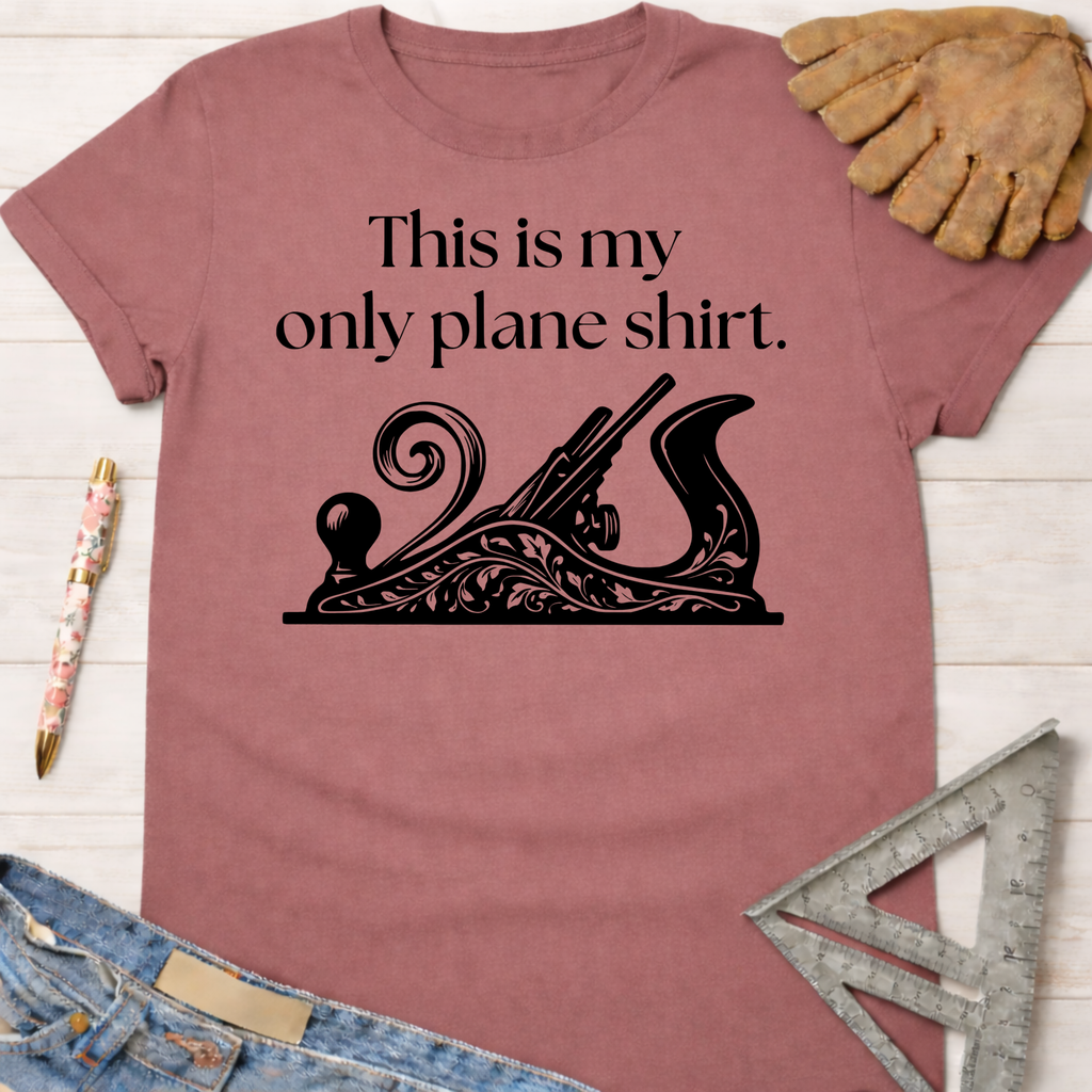 Women's funny woodworking graphic tee shirt for female woodworkers, makers, and DIY builders — Sawdust & Ponytails. Dusty rose t-shirt with "This is my only plane shirt" text and an ornate hand plane graphic.