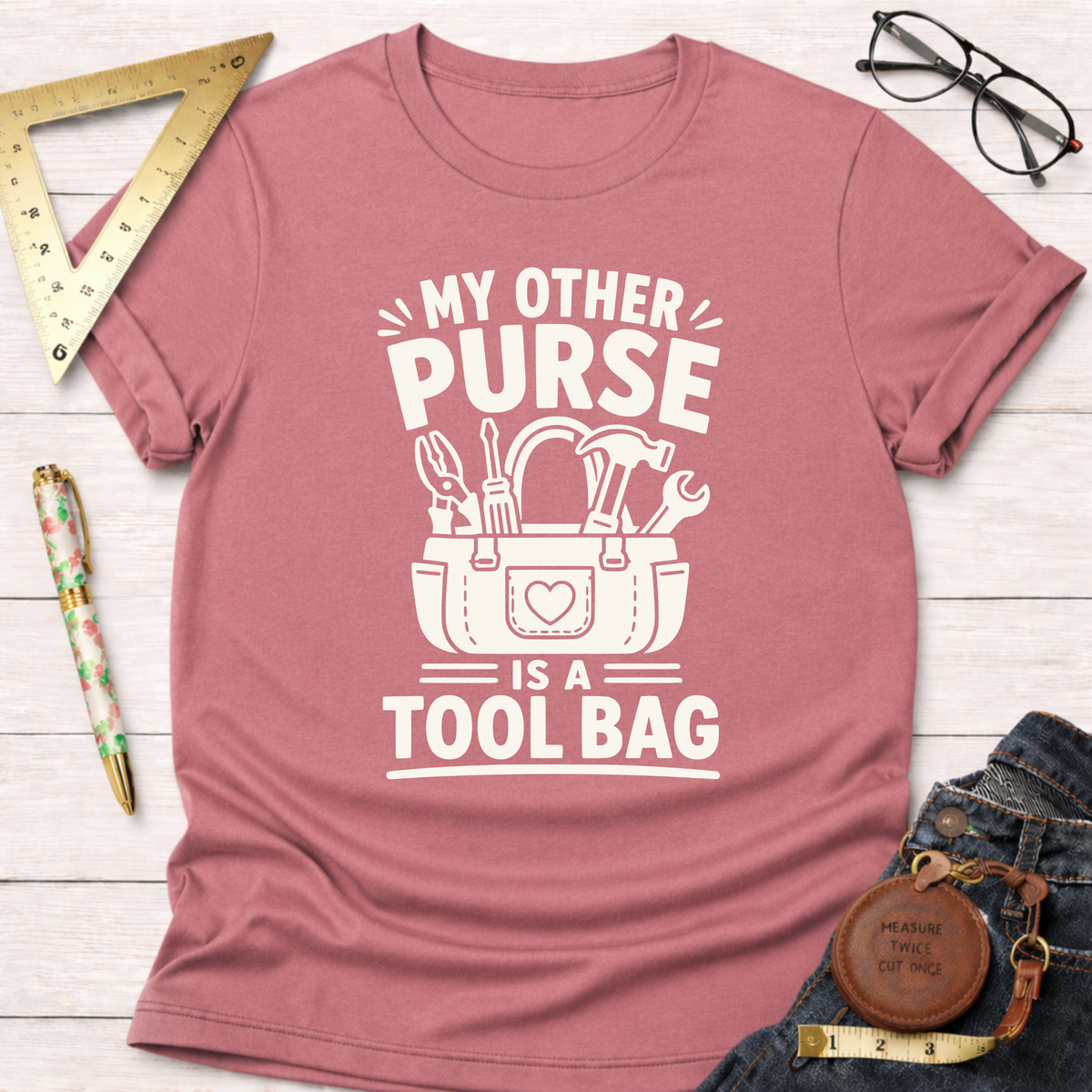 Heather mauve t-shirt with "My Other Purse Is a Tool Bag" design featuring a white tool bag graphic.