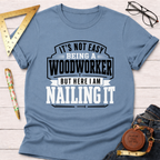 Blue cotton "Nailing It" t-shirt for woodworkers, featuring bold white and black text.