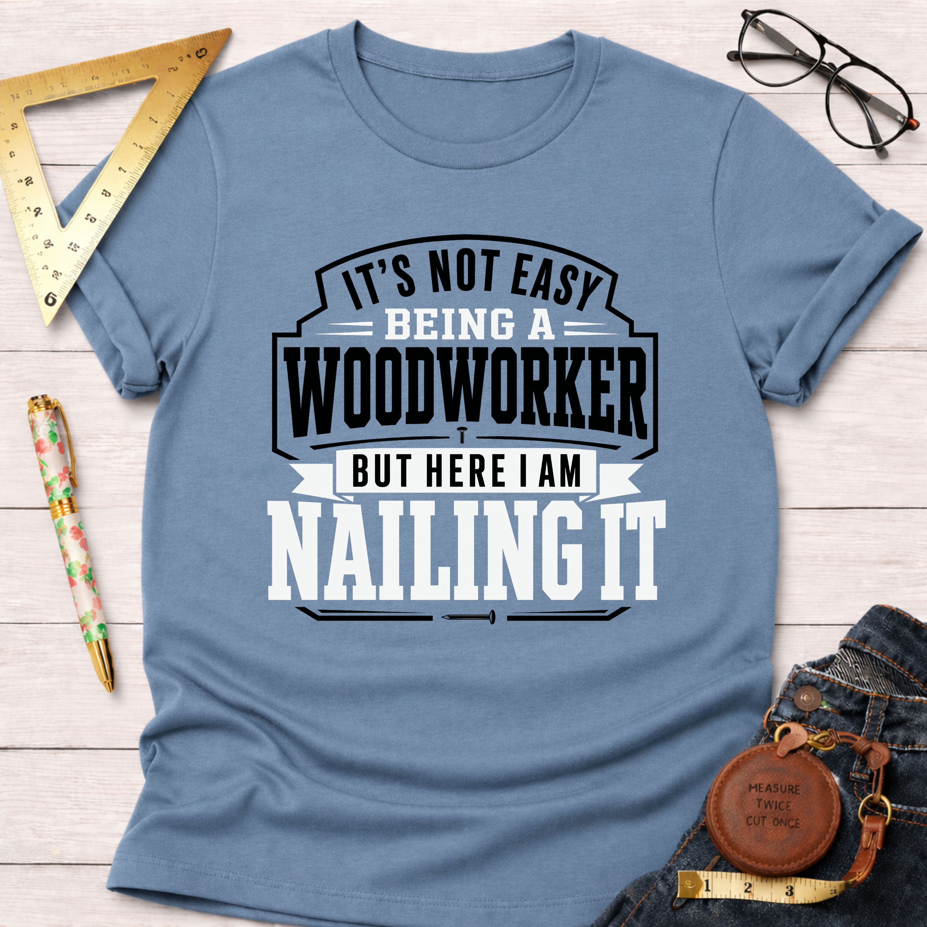 Blue cotton "Nailing It" t-shirt for woodworkers, featuring bold white and black text.