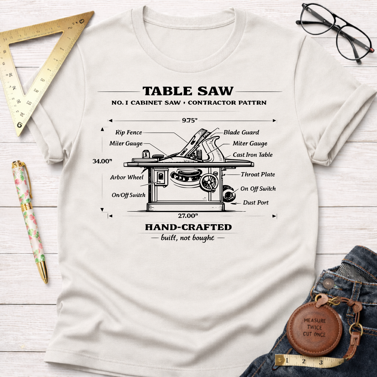 Women's funny woodworking graphic tee shirt for female woodworkers, makers, and DIY builders — Sawdust & Ponytails. Cream t-shirt with vintage black table saw blueprint illustration.