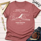 Women's funny woodworking graphic tee shirt for female woodworkers, makers, and DIY builders — Sawdust & Ponytails. Heather clay t-shirt with a white No. 4 bench plane diagram.