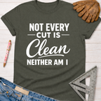 Women's funny woodworking graphic tee shirt for female woodworkers, makers, and DIY builders — Sawdust & Ponytails. Dark gray cotton tee with "Not Every Cut Is Clean Neither Am I" in white text.
