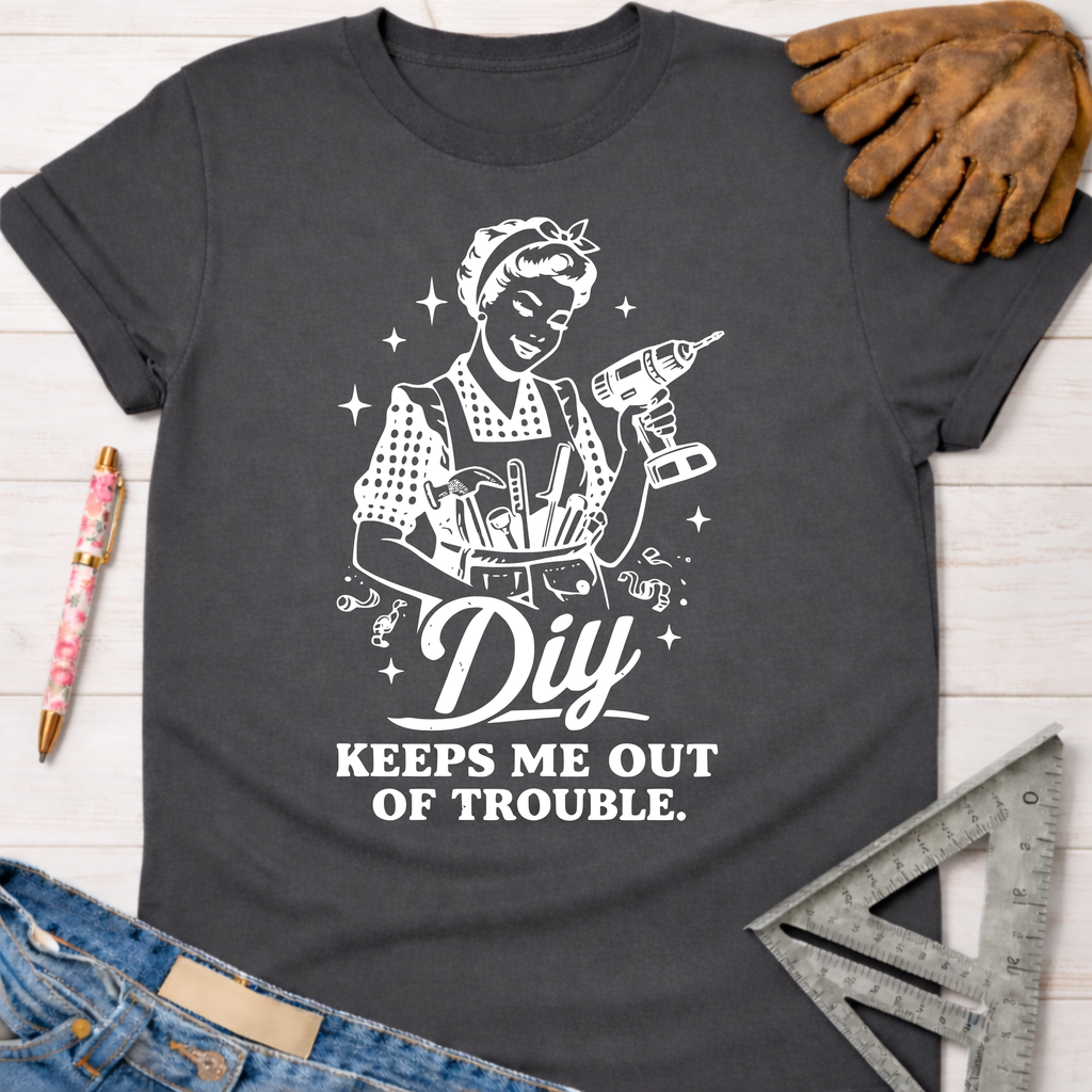 Charcoal gray women's "DIY Keeps Me Out Of Trouble" graphic tee with a retro female builder.