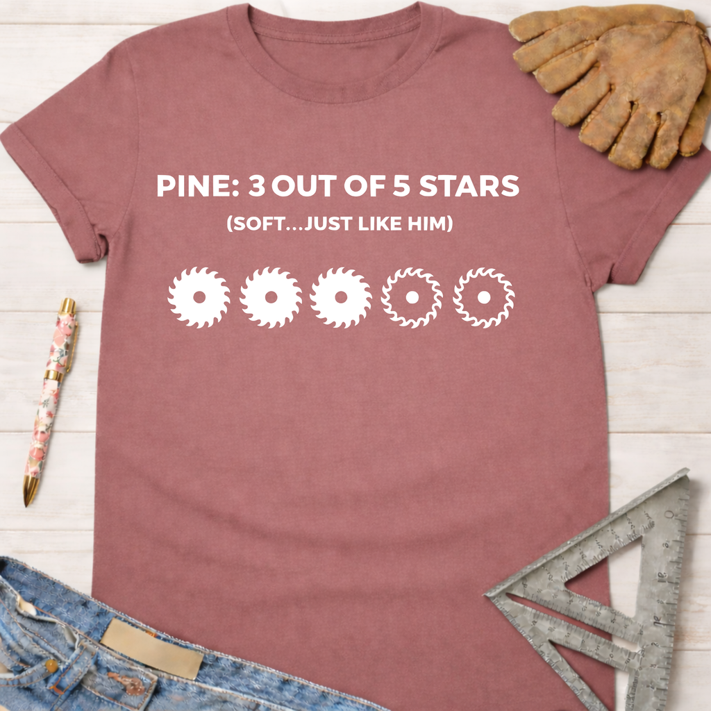 Women's funny woodworking graphic tee shirt for female woodworkers, makers, and DIY builders — Sawdust & Ponytails. Mauve cotton tee with "PINE: 3 OUT OF 5 STARS (SOFT...JUST LIKE HIM)" and saw blade graphics.