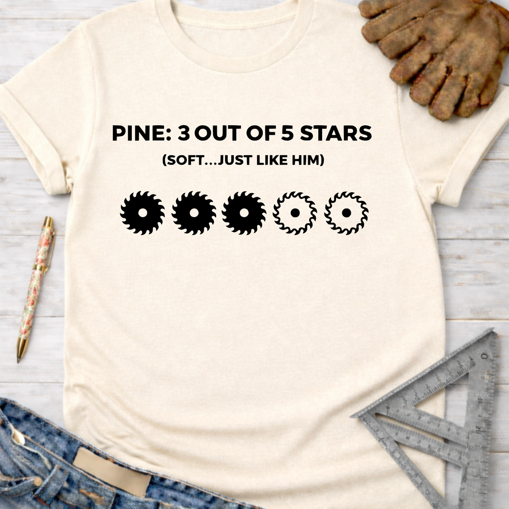 Women's funny woodworking graphic tee shirt for female woodworkers, makers, and DIY builders — Sawdust & Ponytails. Cream cotton tee with "PINE: 3 OUT OF 5 STARS (SOFT...JUST LIKE HIM)" and three solid saw blades, two outlined.