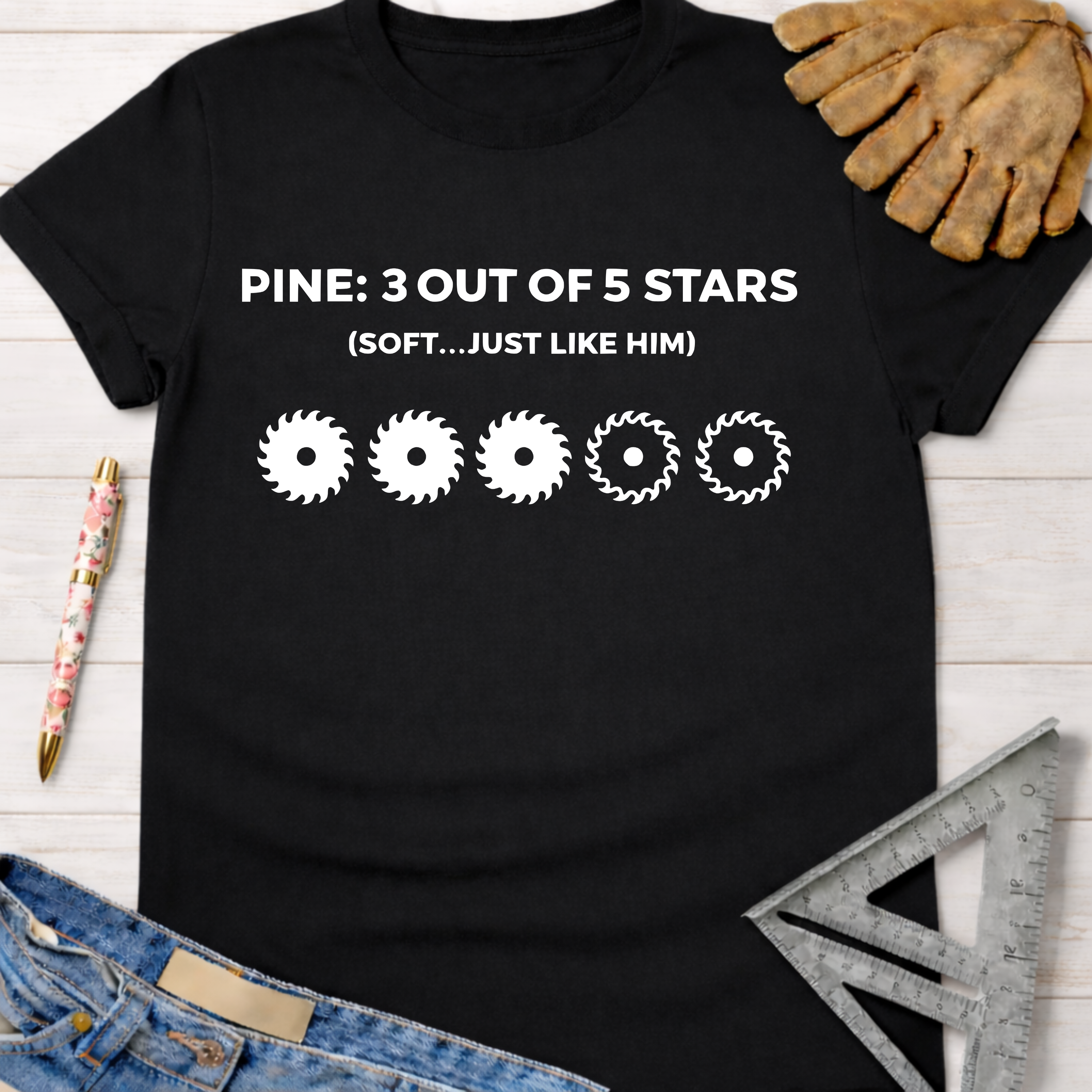 Black cotton tee with "PINE: 3 OUT OF 5 STARS (SOFT...JUST LIKE HIM)" and saw blade graphic. Women's funny woodworking graphic tee shirt for female woodworkers, makers, and DIY builders — Sawdust & Ponytails.