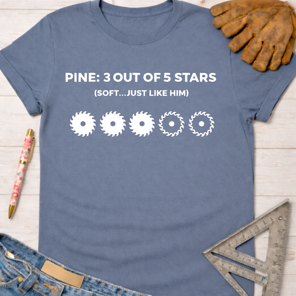 Women's funny woodworking graphic tee shirt for female woodworkers, makers, and DIY builders — Sawdust & Ponytails. Blue cotton tee with "PINE: 3 OUT OF 5 STARS (SOFT...JUST LIKE HIM)" and three saw blade icons.