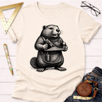 Cream t-shirt with a black and white graphic of a beaver wearing an apron and holding a wood plane.