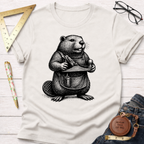Cream t-shirt with a black and white graphic of a beaver wearing an apron and holding a woodworking plane.