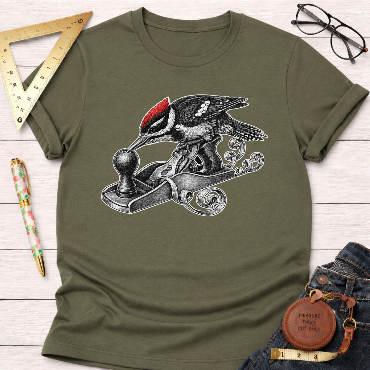 Olive green cotton t-shirt with a woodpecker using a hand planer design.