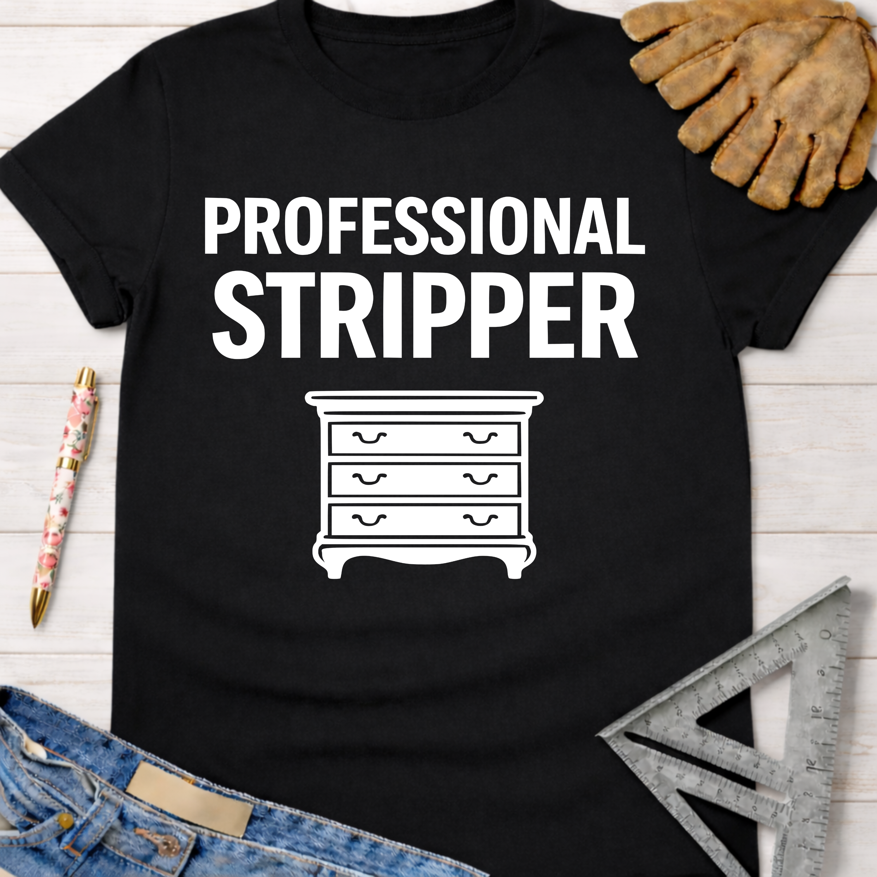Black cotton "Professional Stripper" tee with a white dresser graphic, perfect for female woodworkers and DIY builders.