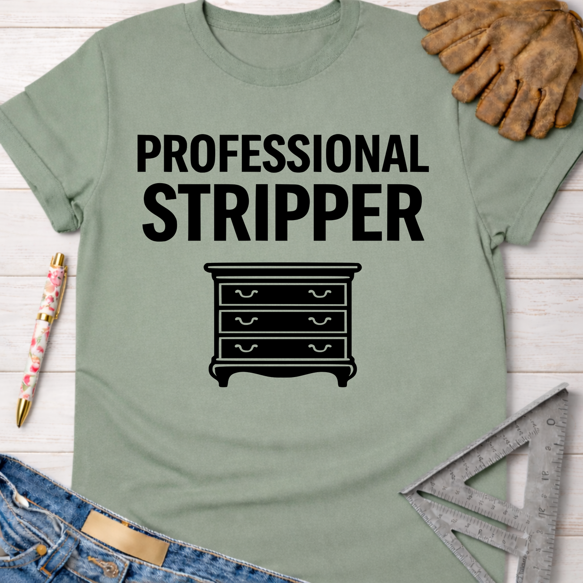 Women's funny woodworking graphic tee shirt for female woodworkers, makers, and DIY builders — Sawdust & Ponytails. Sage green cotton t-shirt with "Professional Stripper" text and a dresser graphic.