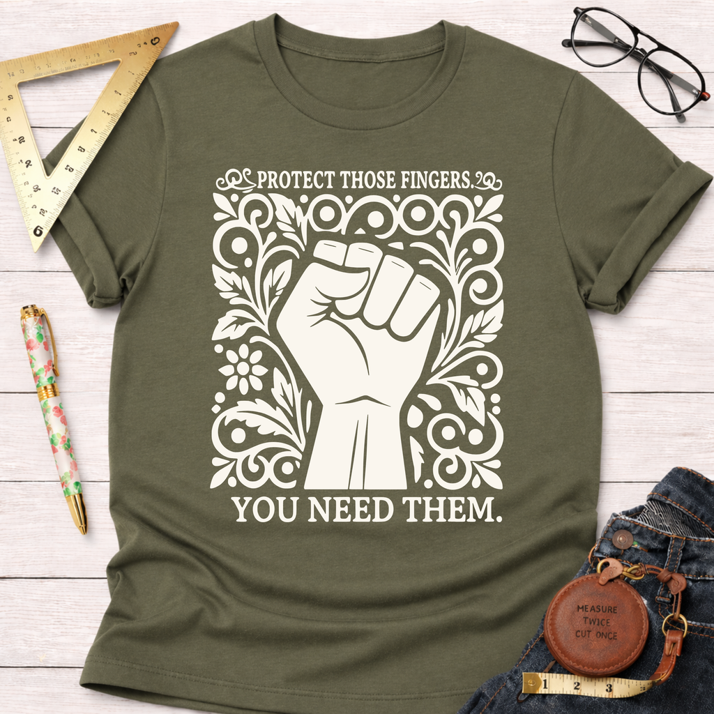 Olive green cotton t-shirt with a white graphic of a fist surrounded by ornate floral designs and the text "PROTECT THOSE FINGERS. YOU NEED THEM.