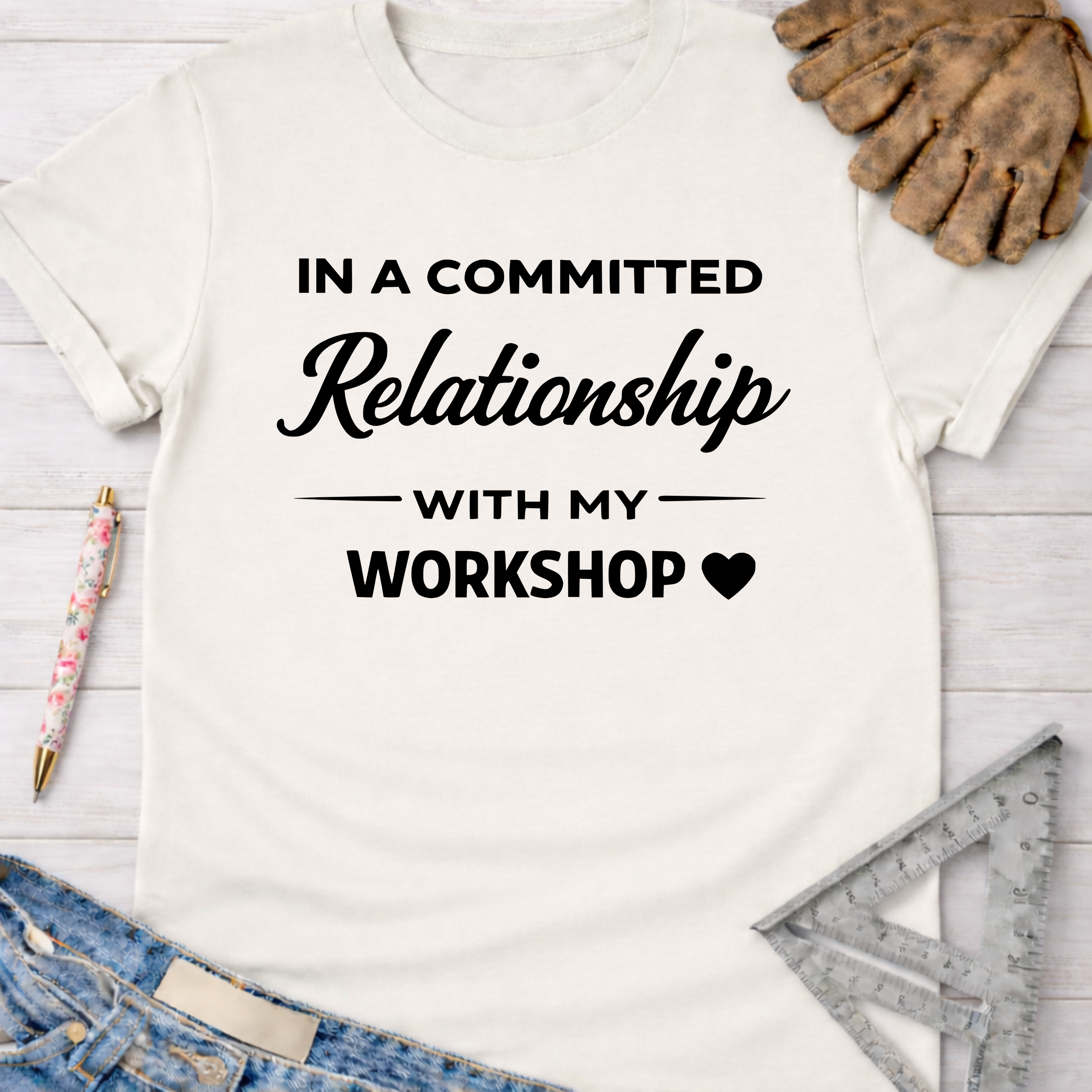 Women's funny woodworking graphic tee shirt for female woodworkers, makers, and DIY builders — Sawdust & Ponytails. White cotton t-shirt with "In A Committed Relationship With My Workshop" text.