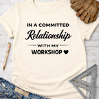 Women's funny woodworking graphic tee shirt for female woodworkers, makers, and DIY builders — Sawdust & Ponytails. Cream t-shirt with "In a Committed Relationship with My Workshop" text.