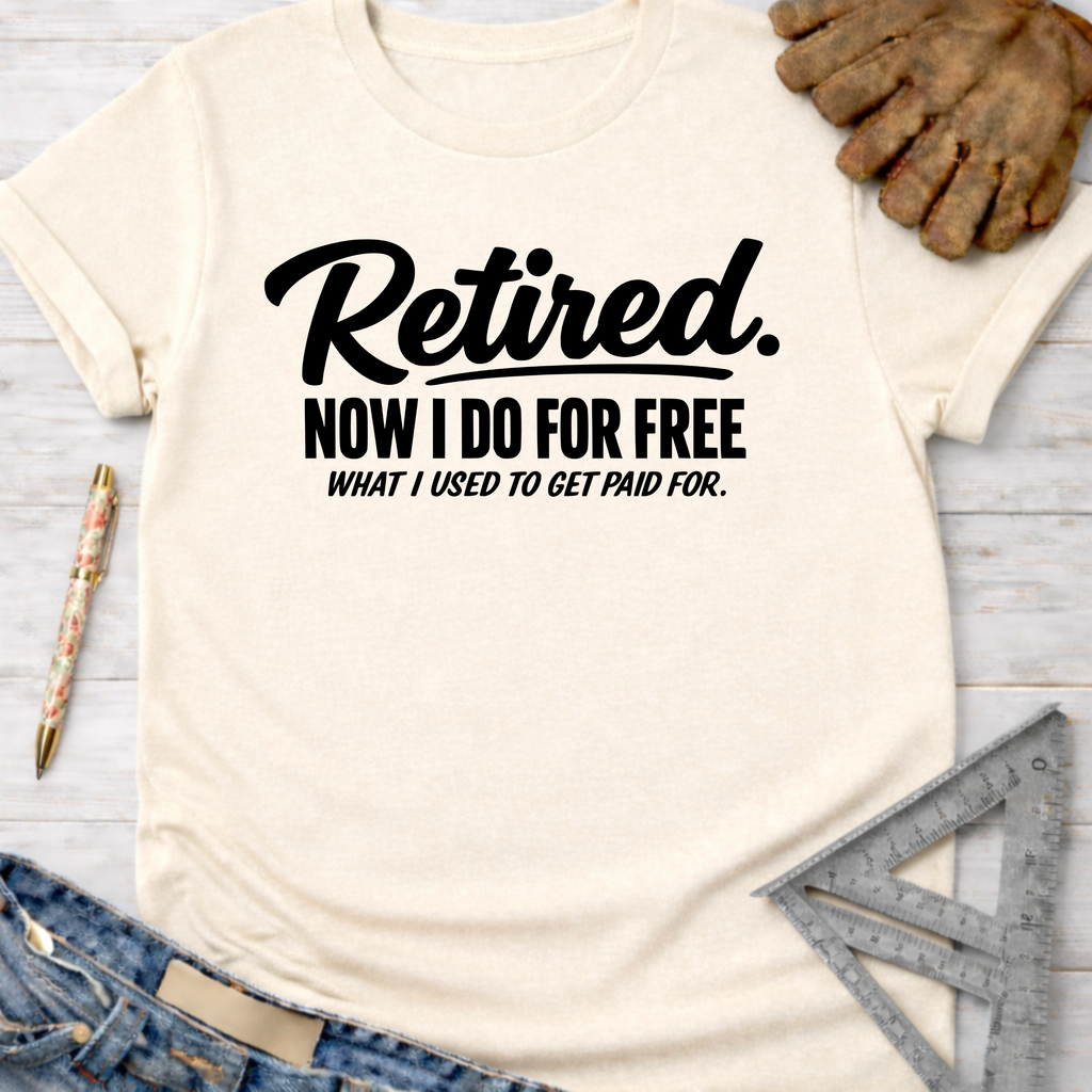 Women's funny woodworking graphic tee shirt for female woodworkers, makers, and DIY builders — Sawdust & Ponytails. Cream t-shirt with "Retired. Now I Do For Free What I Used To Get Paid For." in black text.