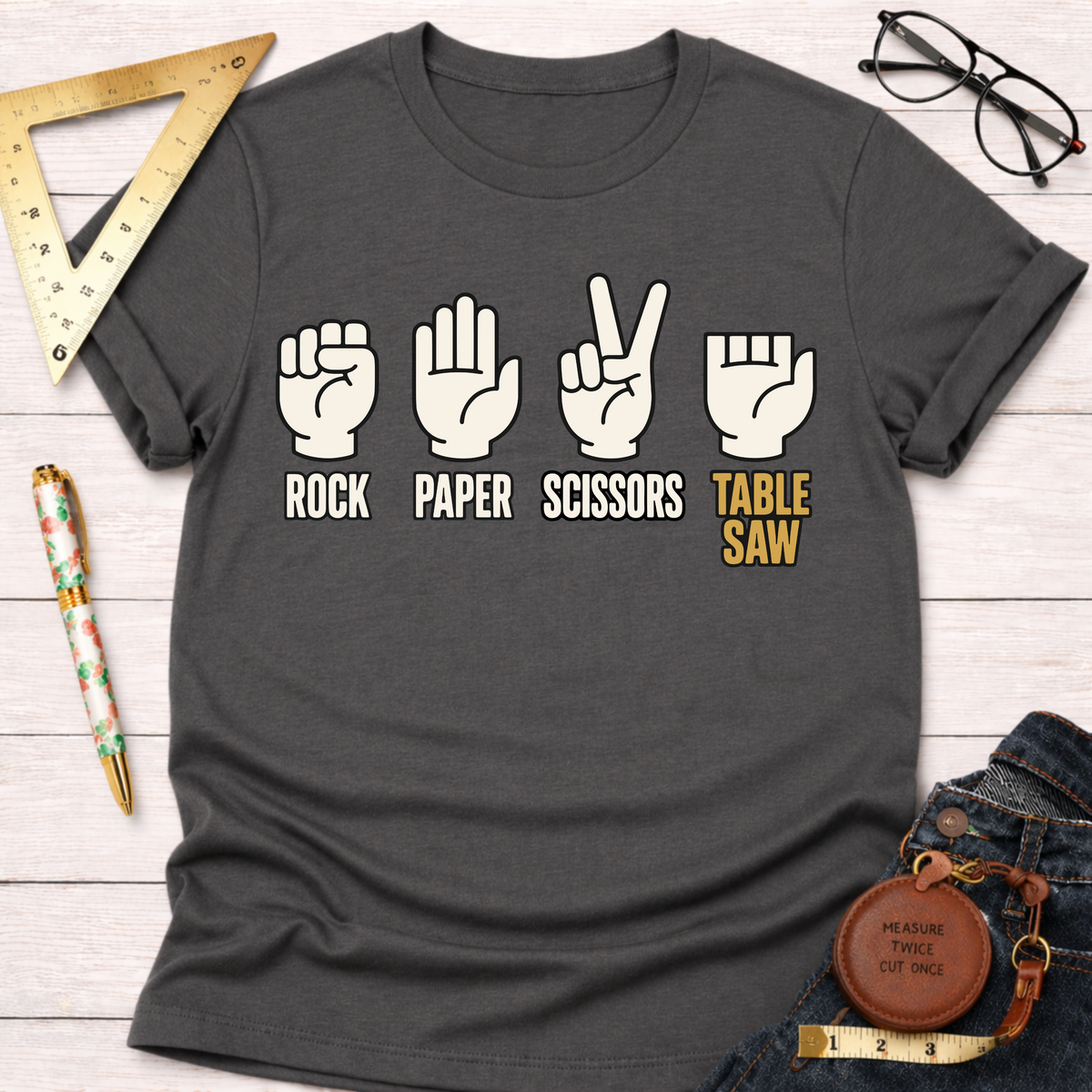 Charcoal gray t-shirt with "Rock Paper Scissors Table Saw" graphic.