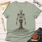 Unisex sage green cotton t-shirt with a detailed wood skeleton graphic, featuring roots as legs.