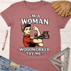 Women's funny woodworking graphic tee shirt for female woodworkers, makers, and DIY builders — Sawdust & Ponytails. Mauve cotton tee with Rosie the Riveter holding a wood plane.