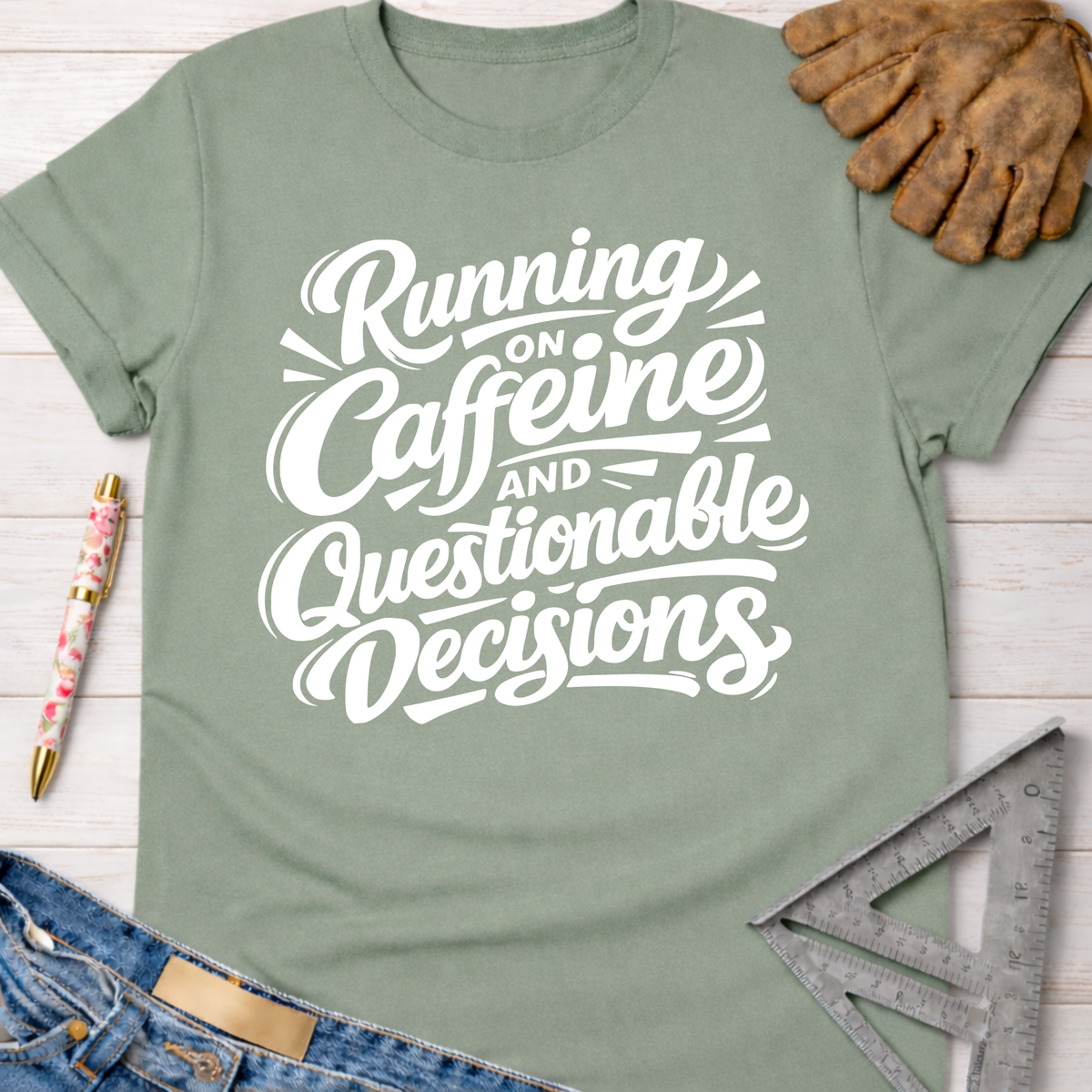 Women's funny woodworking graphic tee shirt for female woodworkers, makers, and DIY builders — Sawdust & Ponytails. Sage green cotton tee with "Running on Caffeine and Questionable Decisions" in white script.