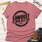 Pink cotton t-shirt with "Sawdust Is Man Glitter" graphic inside a saw blade design.