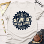 White "Sawdust Is Man Glitter" t-shirt with a saw blade graphic, dark blue text, and tools.