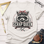 Off-white cotton t-shirt with a "Scrap Queen" raccoon wearing a bandana and sunglasses design.