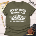 Olive green t-shirt with "Scrap Wood Retirement Plan" text and a pile of wood scraps graphic.