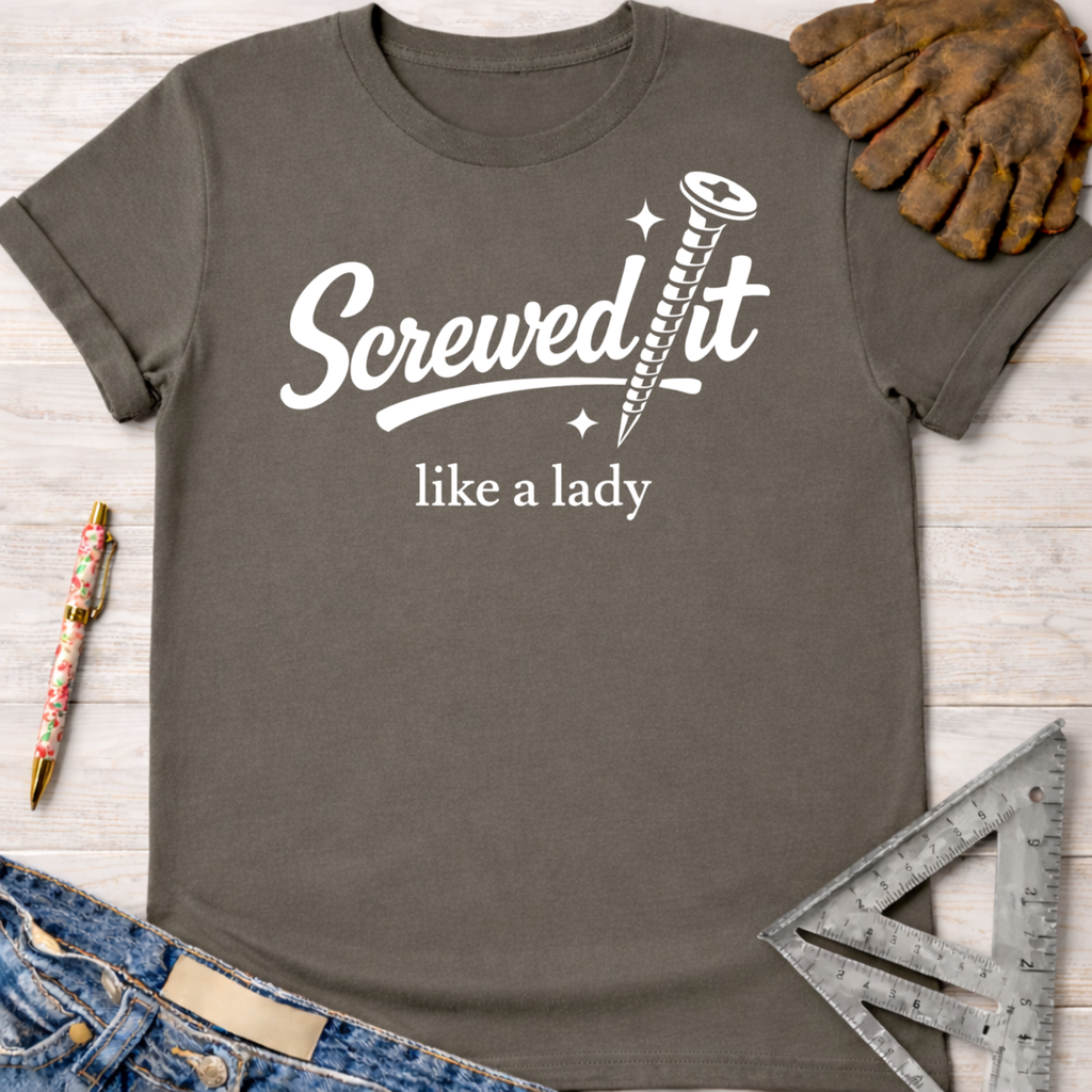 Women's funny woodworking graphic tee shirt for female woodworkers, makers, and DIY builders — Sawdust & Ponytails. Dark gray cotton t-shirt with "Screwed it like a lady" text and a screw graphic.