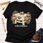 Black "She Builds" t-shirt with a table saw surrounded by pink flowers.