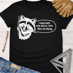 Black cotton "She's Terrifying" tee with a white graphic raccoon and speech bubble. Women's funny woodworking graphic tee shirt for female woodworkers, makers, and DIY builders — Sawdust & Ponytails